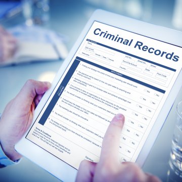background check services truthfinder cost price how much man holding tablet checking criminal records